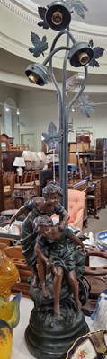 Lot 460 - A French figural table lamp in the form of two...