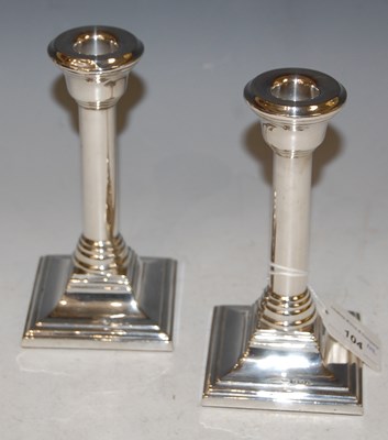 Lot 104 - A pair of Birmingham silver candlesticks.