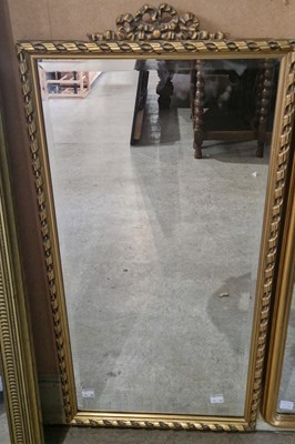 Lot 656 - A gilt framed rectangular bevelled wall mirror...