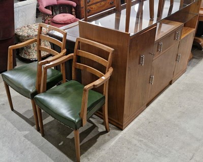 Lot 722 - An Art Deco style walnut dining room suite...