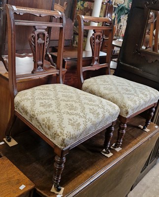 Lot 684 - A pair of Victorian walnut low side chairs...