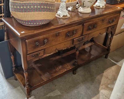 Lot 692 - A reproduction oak dresser, fitted with two...