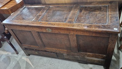 Lot 704 - An antique oak coffer, the hinged triple panel...