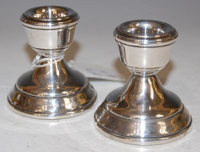 Lot 118 - A pair of Birmingham silver candle stands.