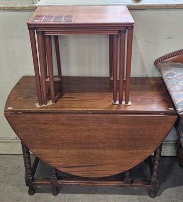 Lot 698 - A mid-century teak nest of three tables,...