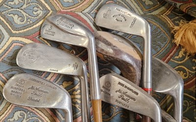 Lot 504 - A collection of assorted vintage golf clubs to...