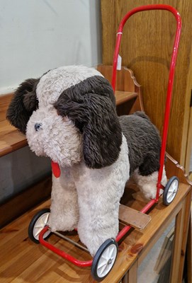 Lot 674 - A vintage childs push toy in the form of a dog.