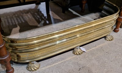 Lot 714 - An early 19th century brass fire fender of...