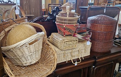 Lot 720 - A large collection of assorted wicker baskets,...