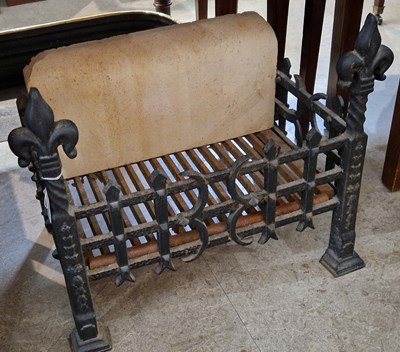 Lot 721 - A cast iron free standing fire basket with...