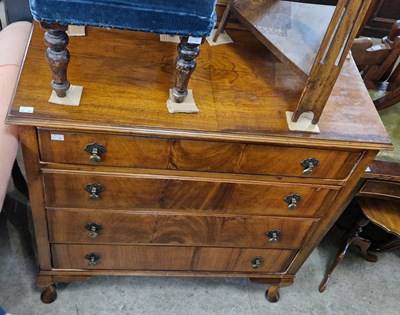 Lot 745 - An early 20th century walnut chest of four...