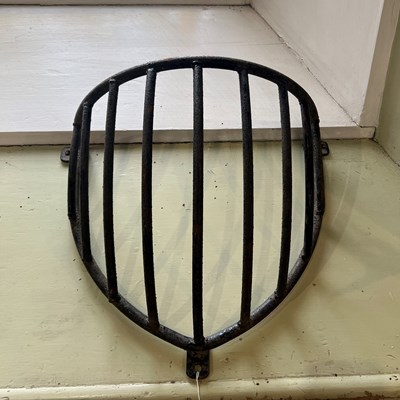 Lot 665 - An antique cast iron horse feeder basket.