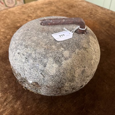 Lot 777 - An antique curling stone.