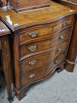 Lot 751 - A reproduction walnut serpentine chest of...