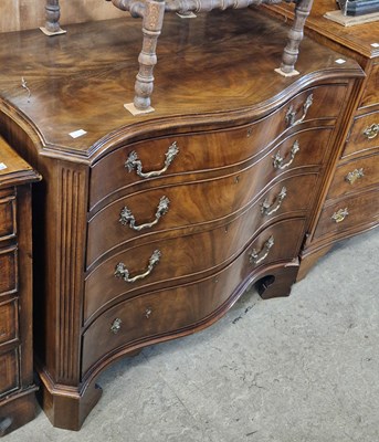 Lot 752 - A George III style mahogany serpentine chest,...