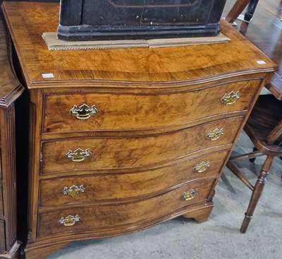 Lot 753 - A reproduction walnut serpentine chest, fitted...