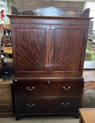 Lot 765 - A George III style mahogany linen press, the...