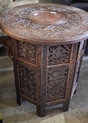 Lot 775 - An early 20th century Eastern carved wood and...