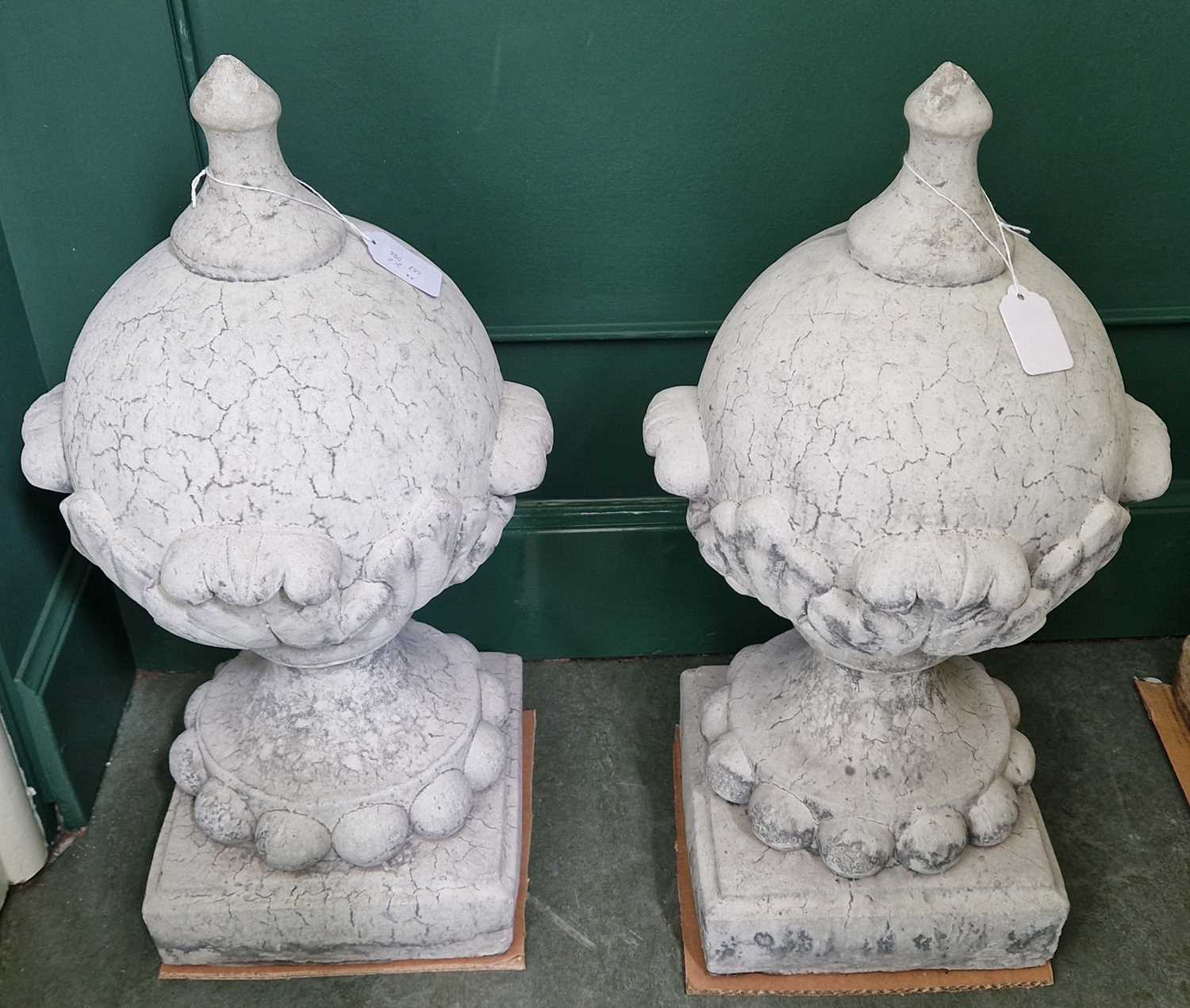 Lot 778 - A pair of composite stone ornamental finials,