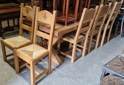 Lot 730 - A 20th century oak refectory table and eight...