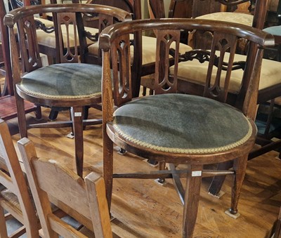 Lot 787 - A pair of oak circular chairs with green...