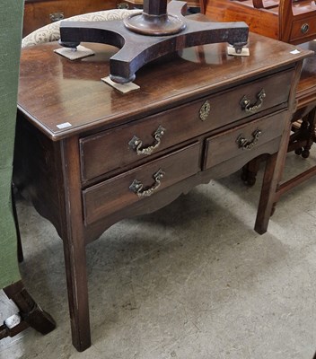 Lot 789 - A George III mahogany lowboy, the rectangular...