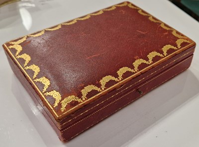 Lot 209B - Cartier - a vintage red leather covered...