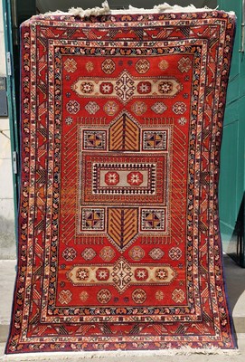 Lot 880 - A madder ground Persian rug, 20th century, the...