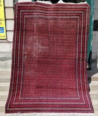 Lot 874 - A Persian rug, 20th century, the rectangular...