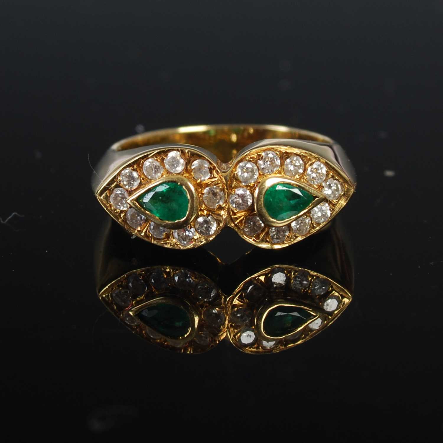 Lot 208 - An 18ct gold emerald and diamond double...
