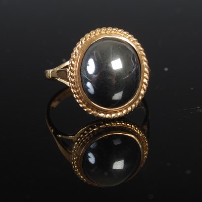 Lot 208I - A 9ct gold and oval cabochon hematite ring,...