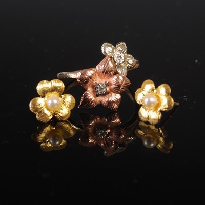 Lot 208S - A 9ct gold double flower ring set with two...