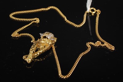 Lot 208Z - A 9ct gold necklace, 5.1g, suspending a yellow...