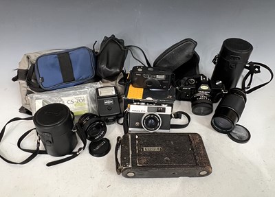 Lot 575 - Box - assorted cameras and lenses to include a...