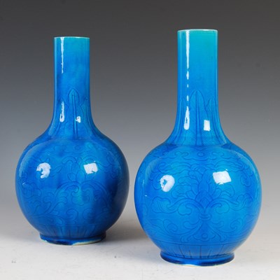 Lot 519 - A pair of Chinese porcelain monochrome bottle...