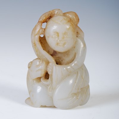 Lot 537 - A Chinese pale celadon jade figure of a boy...