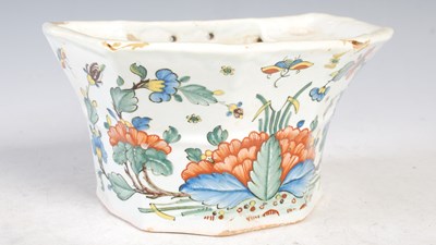 Lot 485 - An antique Delft pottery flowerpot, decorated...