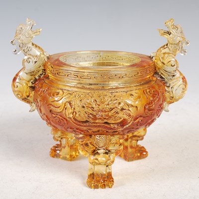 Lot 6 - A Chinese amber coloured glass Koro base with...