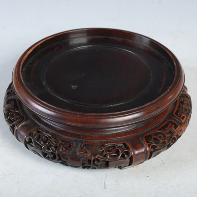 Lot 329 - A Chinese carved and pierced darkwood circular...