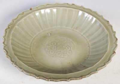 Lot 514 - A Chinese porcelain celadon glazed dish, Qing...