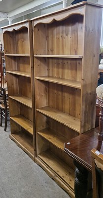 Lot 777 - A pair of pine open bookcases each with four...