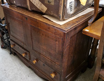 Lot 787 - An antique oak storage chest, the hinged top...