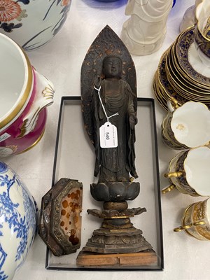 Lot 540 - A carved wooden figure of Guanyin standing...