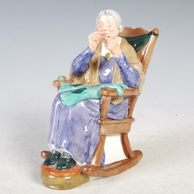 Lot 10 - A Royal Doulton figure, "A Stitch in Time"...