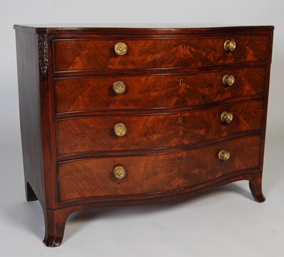 Lot 39 - A George III mahogany serpentine chest, after...