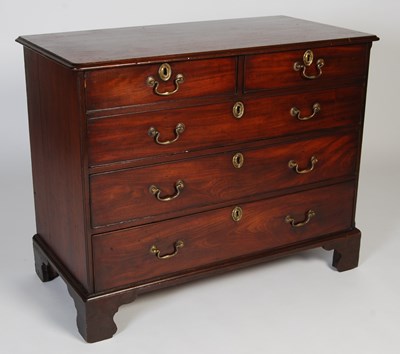 Lot 27 - A George III mahogany chest, the rounded...