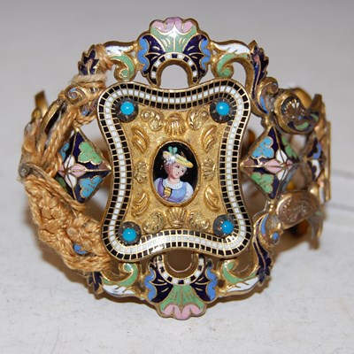 Lot 171 - A yellow metal and enamel cuff bangle.