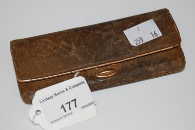 Lot 177 - A 9ct gold mounted leather purse.