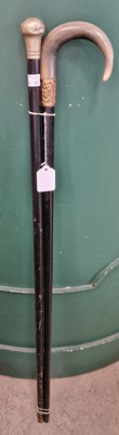 Lot 616 - An Antique ebonised horn-handled walking cane...