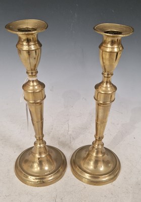 Lot 407 - A pair of brass candlesticks, both 26.5 cm high.